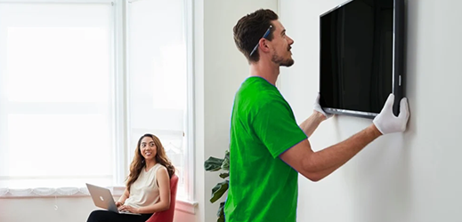 Guy hanging TV